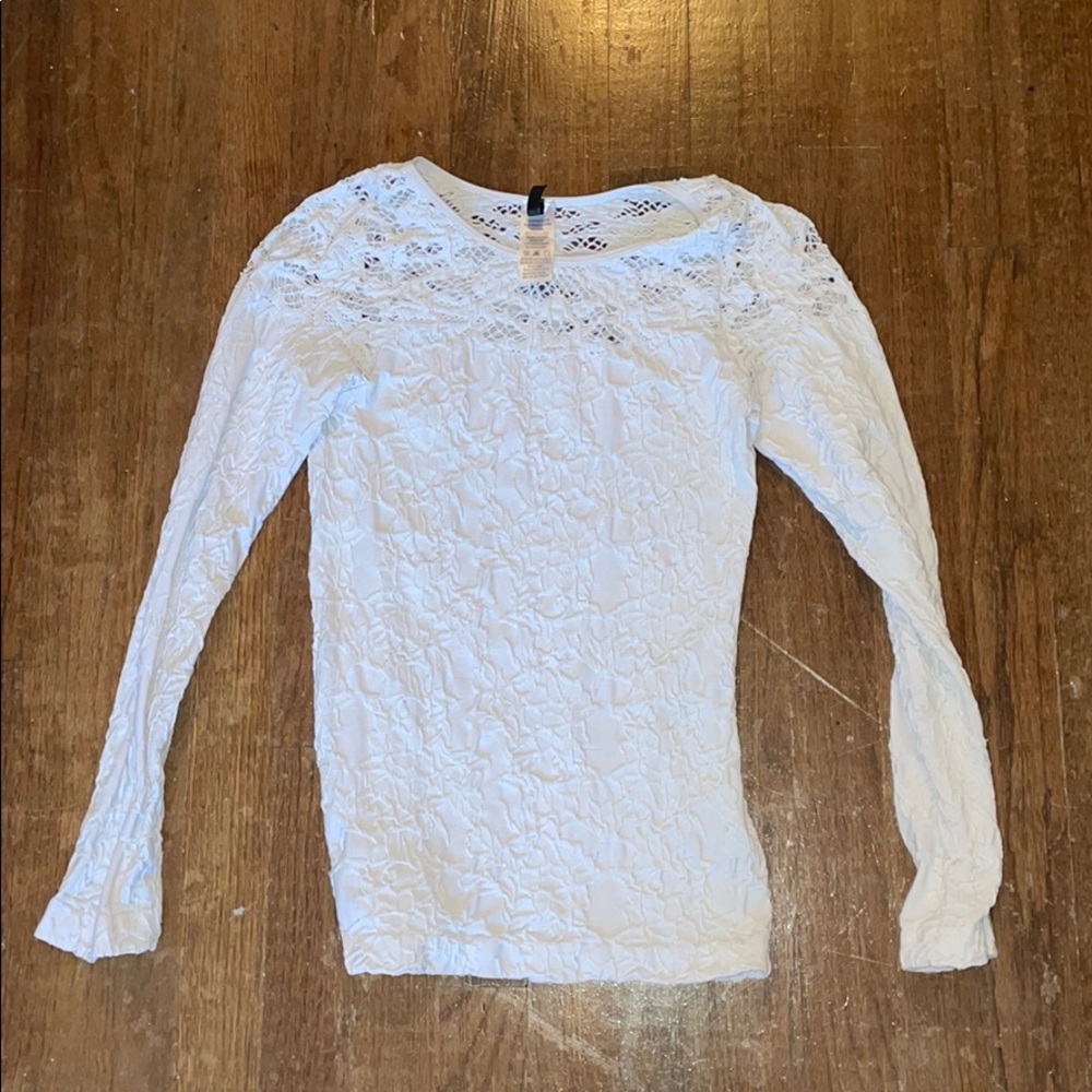A tight long sleeve white shirt.